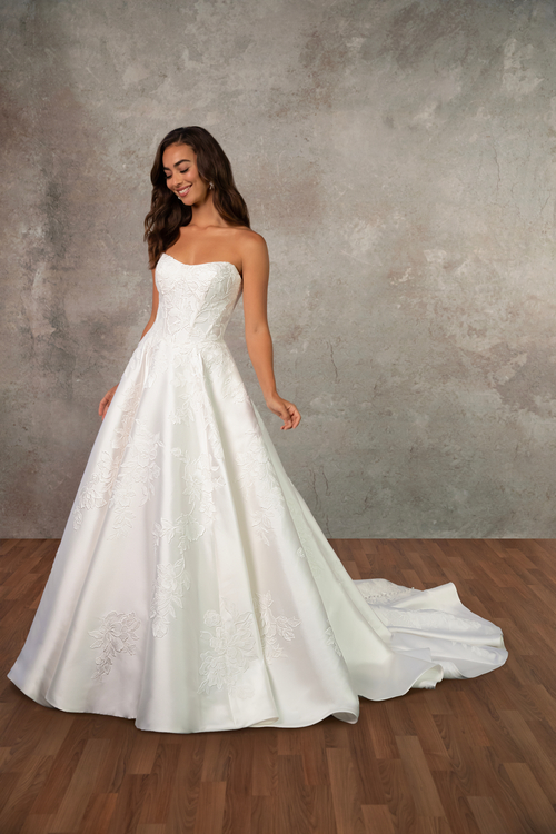 Model wearing a white gown by Essense of Australia