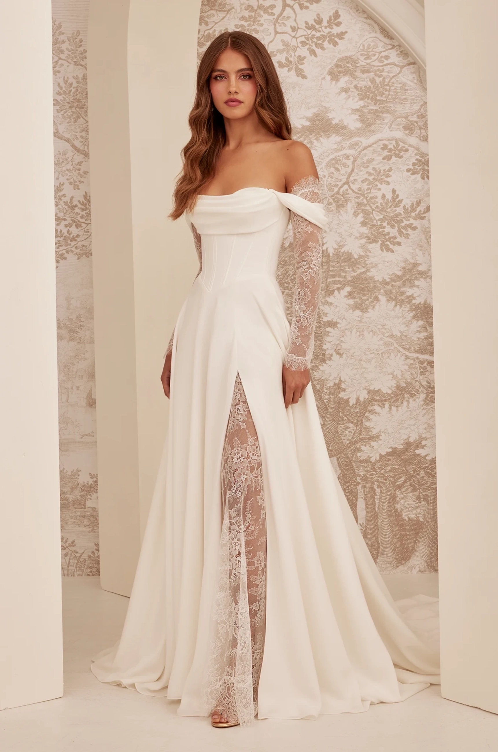 Model wearing a white dress.